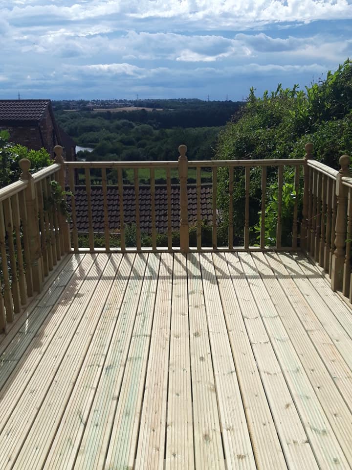 Raised decking with spindle balustrade overlooking countryside near Wakefield